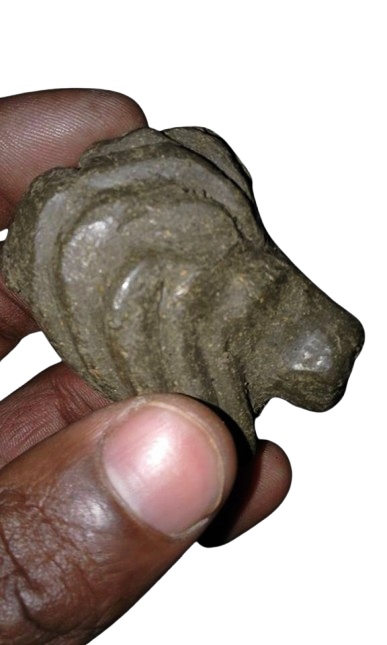 a small lion clay sculpture